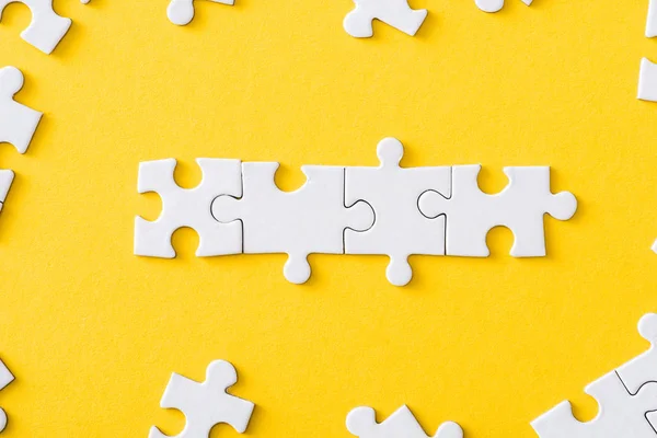 Top View Connected Line White Jigsaw Puzzles Isolated Yellow — Stock Photo, Image