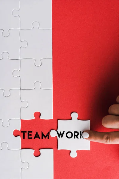 Top View Woman Pointing Finger Jigsaw Connected Puzzle Pieces Teamwork — Stock Photo, Image