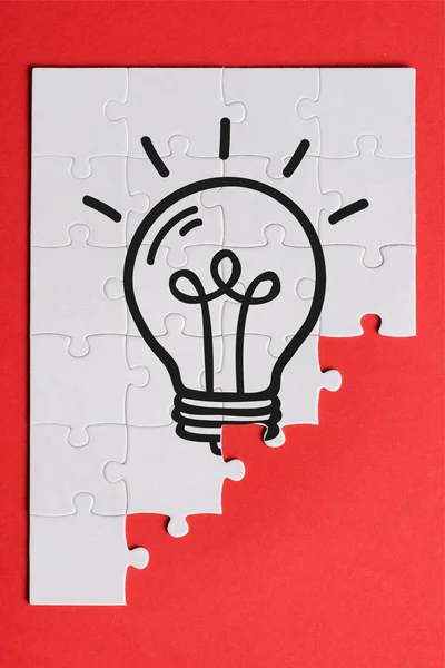 Top View White Connected Puzzle Pieces Light Bulb Isolated Red — Stock Photo, Image