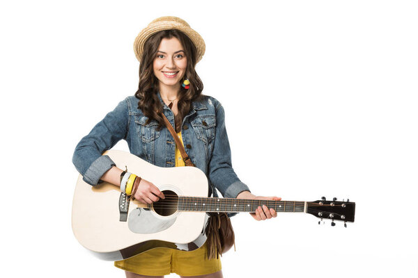smiling boho girl playing acoustic guitar isolated on white