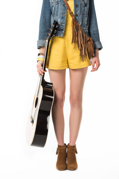 cropped view of boho girl holding acoustic guitar isolated on white