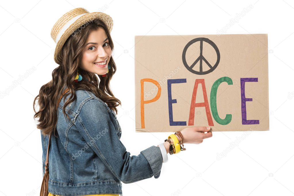smiling boho girl holding placard with inscription isolated on white