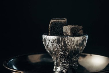 coals on bowl and hookah isolated on black clipart