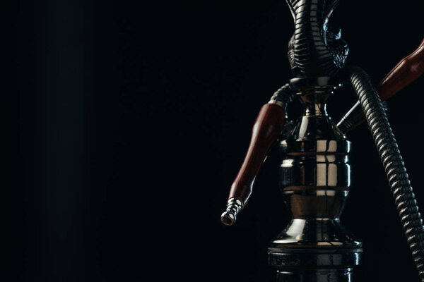 black hookah stem and hose on black with copy space