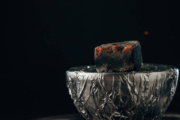 hookah bowl with hot coal isolated on black