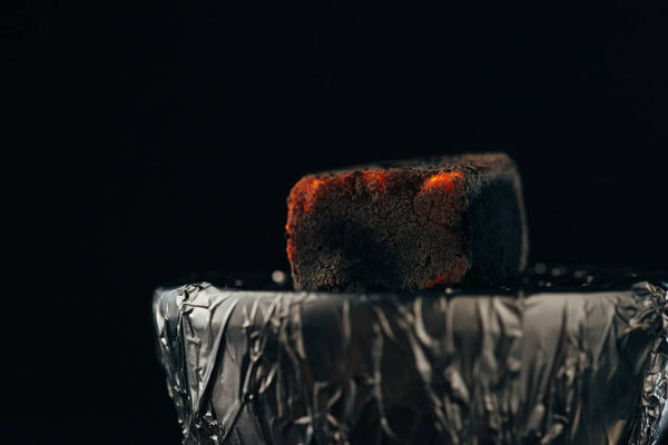 hookah bowl with hot coal isolated on black