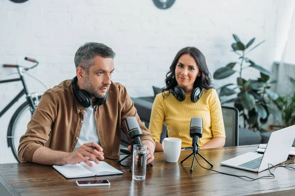 Pretty Radio Host Looking Camera While Sitting Workplace Colleague — Stock Photo, Image