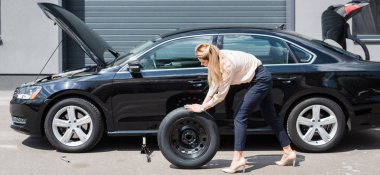 businesswoman rolling new wheel and fixing broken auto, car insurance concept clipart