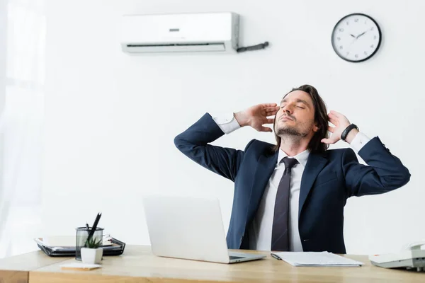 Businessman Sitting Office Air Conditioner Holding Hands Head — Stock Photo, Image