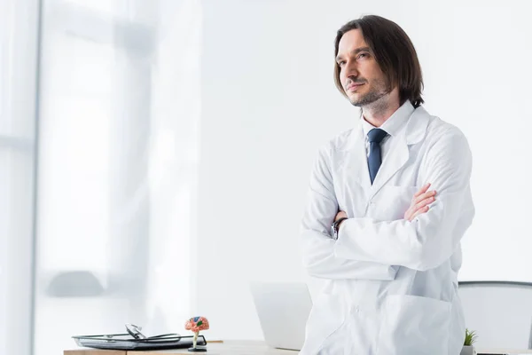 Calm Doctor White Coat Standing Office Crossed Hands Chest Looking — Stock Photo, Image