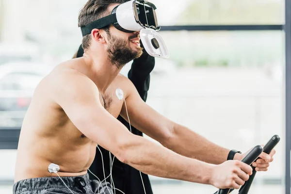 Smiling Shirtless Sportsman Virtual Reality Headset Electrodes Working Out Elliptical — Stock Photo, Image