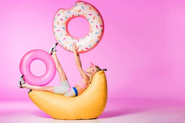 Attractive Girl Bean Bag Chair Inflatable Swim Rings Pink Doll — Stock Photo, Image