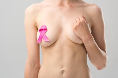 cropped view of naked young woman with pink ribbon isolated on grey clipart