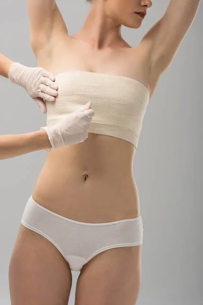 Partial View Plastic Surgeon Latex Gloves Patient Breast Bandage Isolated — Stock Photo, Image
