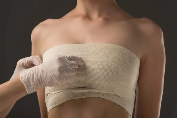 Partial View Plastic Surgeon Latex Gloves Patient Breast Bandage Isolated — Stock Photo, Image