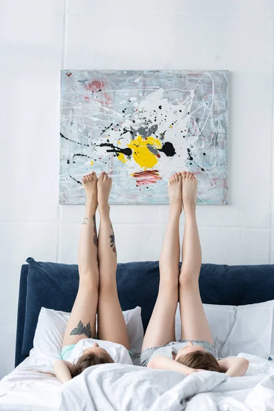 Two Barefoot Lesbians Lying Bed Legs Morning — Stock Photo, Image