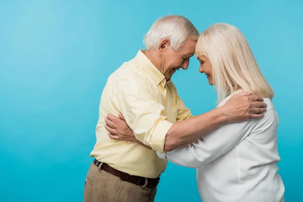 Side View Cheerful Retired Couple Closed Eyes Smiling Isolated Blue — Stock Photo, Image