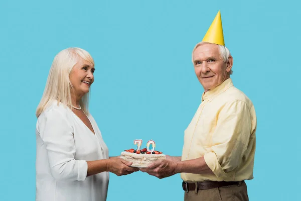 Cheerful Retired Man Party Cap Holding Birthday Cake Wife Isolated — Stock Photo, Image