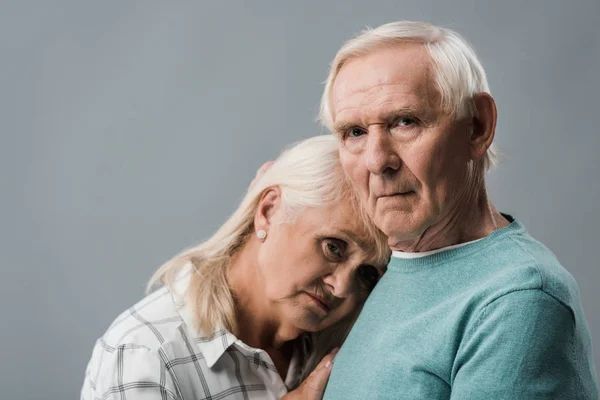 Upset Retired Man Standing Frustrated Wife Isolated Grey — Stock Photo, Image