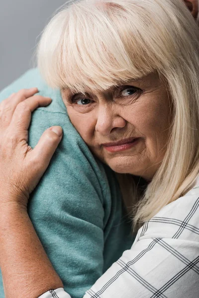 Close Husband Hugging Sad Retired Wife Grey Hair Isolated Grey — Stock Photo, Image