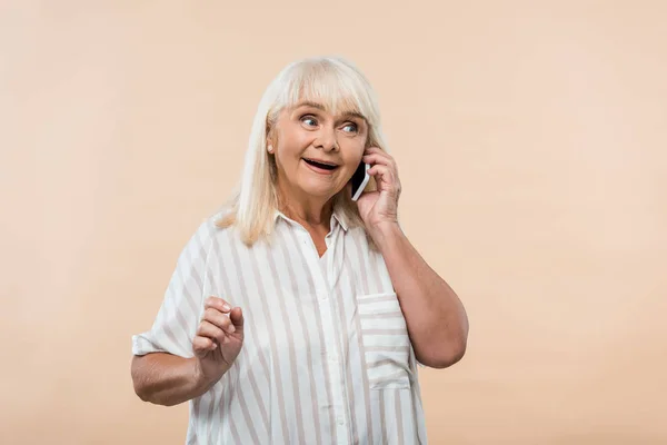 Cheerful Retired Woman Gesturing Talking Smartphone Isolated Beige — Stock Photo, Image