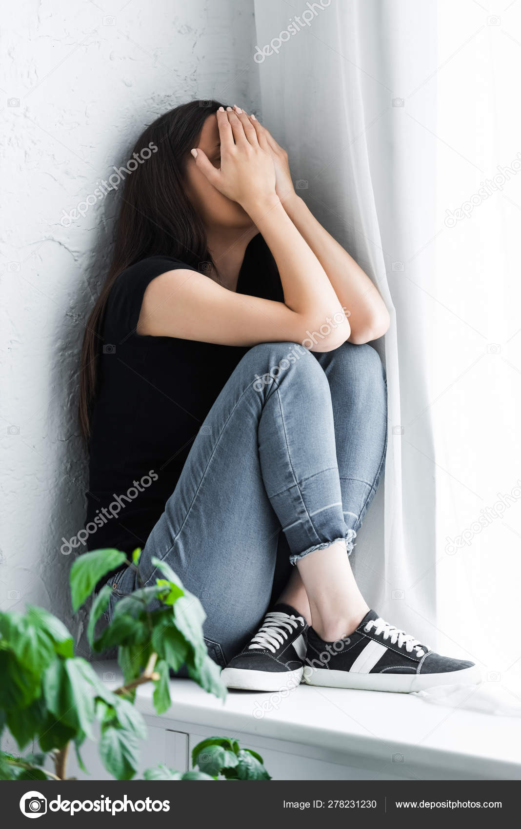 Depressed Young Woman Crying While Sitting Window Sill Covering ...