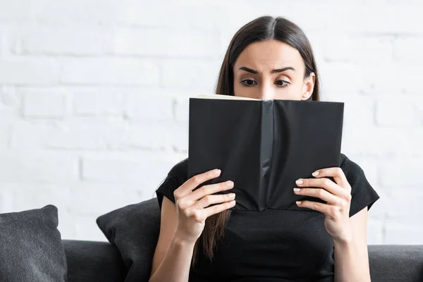 Disappointed Young Woman Covering Face Notebook While Suffering Dementia Home — Stock Photo, Image