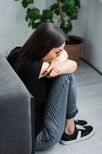 Scared Young Woman Hiding Face Crossed Arms While Sitting Floor — Stock Photo, Image