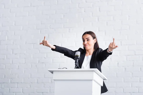 Irritated Lecturer Showing Middle Fingers While Standing Podium Tribune Conference — Stock Photo, Image