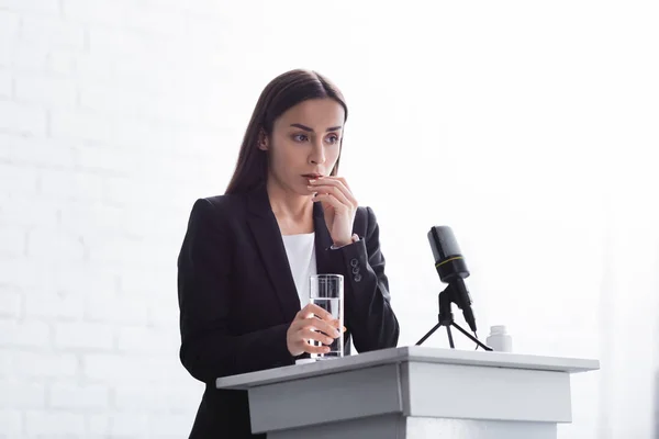 Young Lecturer Suffering Speech Anxiety Standing Podium Tribune Glass Water — Stock Photo, Image