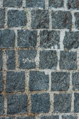 top view of black paving stones on road in city  clipart