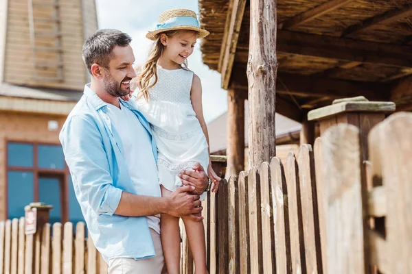 Selective Focus Happy Father Holding Arms Cute Daughter Wooden Fence — Stock Photo, Image