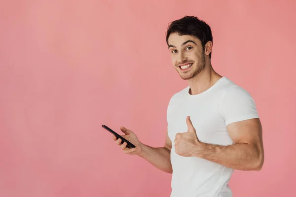 Muscular Man White Shirt Using Smartphone Showing Thumb Isolated Pink — Stock Photo, Image