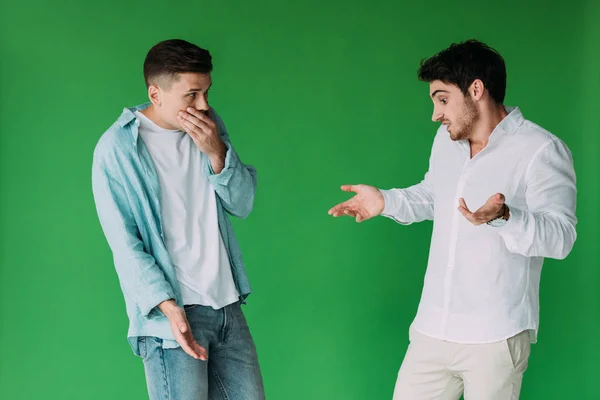 Two Worried Men Shirts Gesturing Isolated Green — Stock Photo, Image