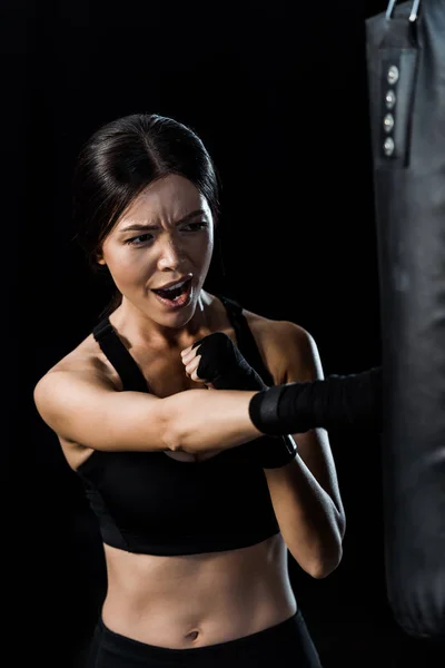 Selective Focus Emotional Sportswoman Boxing Punching Bag Isolated Black — Stock Photo, Image