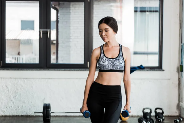 Attractive Girl Sportswear Standing Blue Dumbbells — Stock Photo, Image