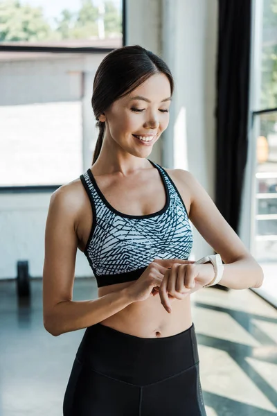 Happy Young Sportswoman Looking Fitness Watch Gym — Stock Photo, Image