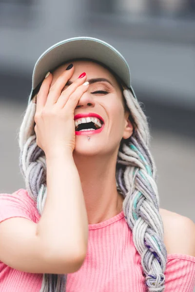 Beautiful Stylish Girl Dreadlocks Hat Laughing Covering Face Hand — Stock Photo, Image
