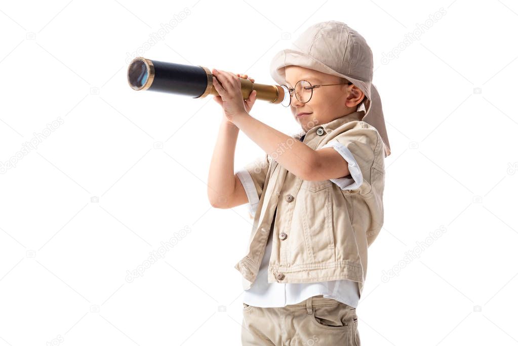 explorer boy in glasses and hat looking through spyglass isolated on white
