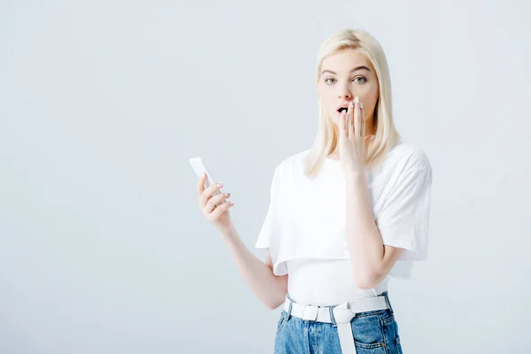 Beautiful Surprised Blonde Girl Using Smartphone Isolated Grey — Stock Photo, Image