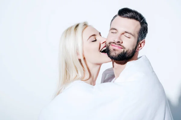 Girlfriend Biting Cheek Boyfriend Covered Blanket White — Stock Photo, Image