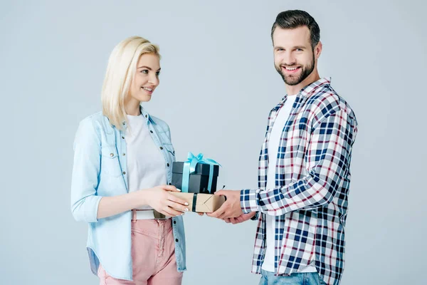 Smiling Man Giving Presents Beautiful Girl Isolated Grey — Stock Photo, Image