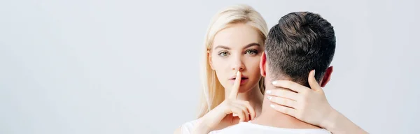 Panoramic Shot Beautiful Girl Embracing Man Doing Silence Gesture Isolated — Stock Photo, Image