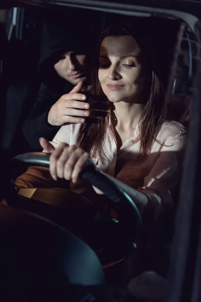 Thief Hiding Backseat Beautiful Smiling Woman — Stock Photo, Image