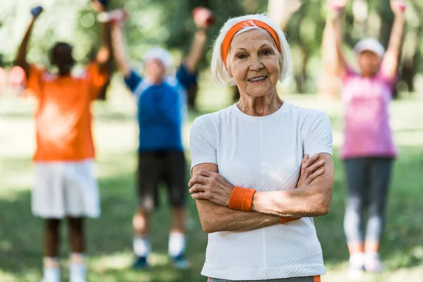 Happy Retired Woman Standing Crossed Arms Multicultural Pensioners — Stock Photo, Image