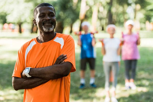 Selective Focus Cheerful African American Man Standing Crossed Arms Pensioners — Stock Photo, Image