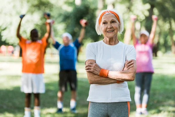 Happy Senior Woman Standing Crossed Arms Multicultural Pensioners — Stock Photo, Image