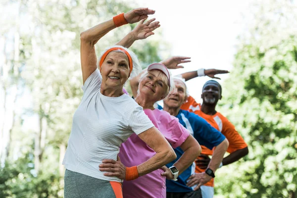 Selective Focus Happy Multicultural Senior Men Women Standing Hands Hips — Stock Photo, Image