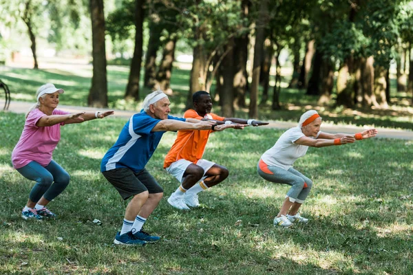 Selective Focus Multicultural Retired Men Women Doing Sit Ups Grass — Stock Photo, Image