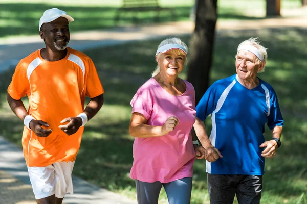 Selective Focus Happy Retired Woman Running Multicultural Men — Stock Photo, Image